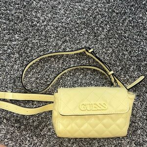 Yellow Guess purse/fanny pack with removable and adjustable straps.